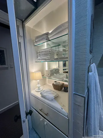 a view of a hallway with seating area