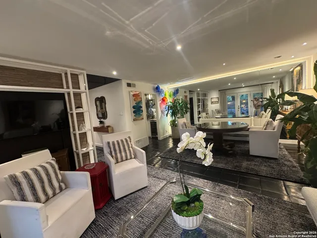 a living room with furniture and a rug