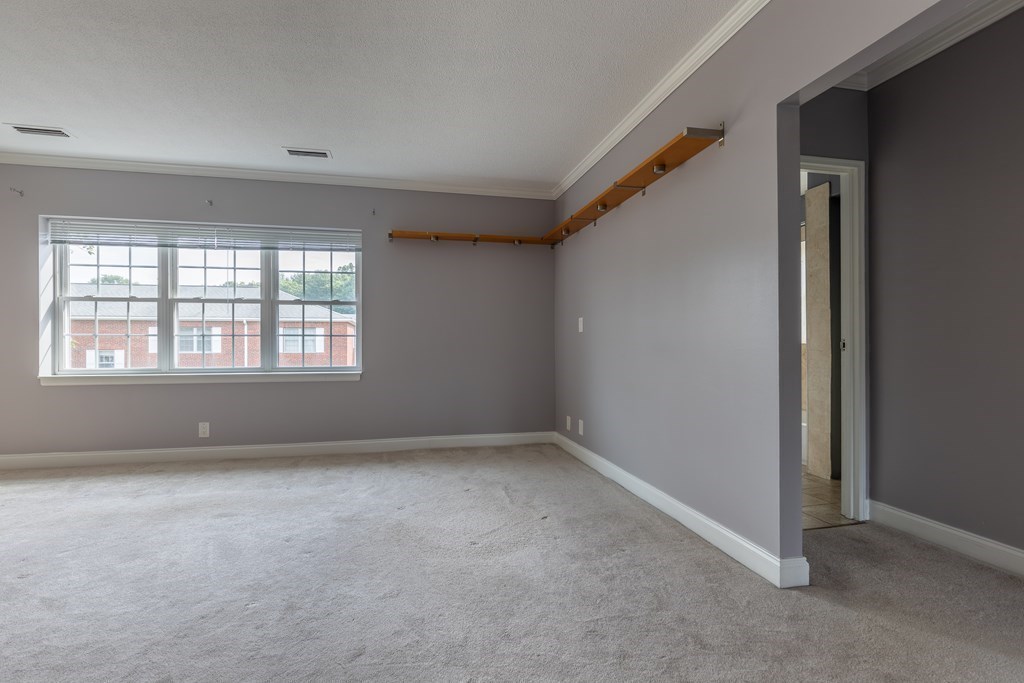 177 Lake Shore Road, Unit 3 Boston, MA 02135 - Photo 8 of 20 an empty room with windows