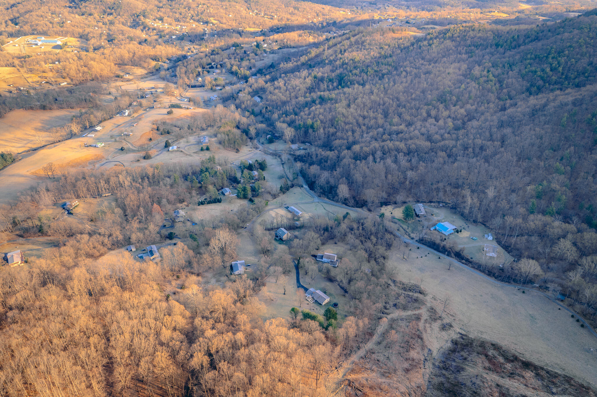 0 Airpoint Road Bent Mountain, VA 24059 - Photo 6 of 18 a view of a dry field with trees in background
