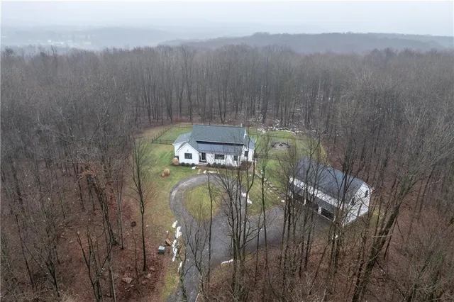 a view of a houses with a green space