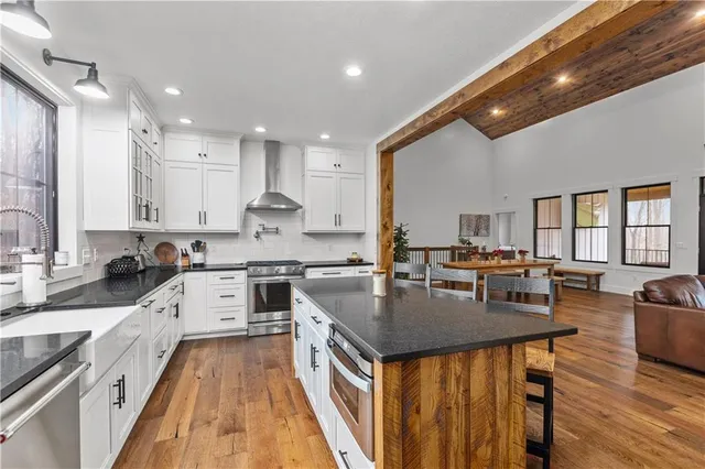 a kitchen with granite countertop lots of counter top space and stainless steel appliances