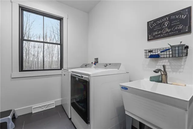 a utility room with dryer and washer