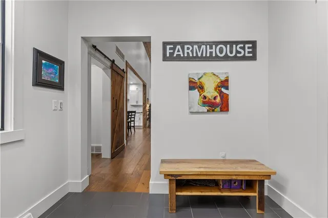 a hallway with chairs and a table