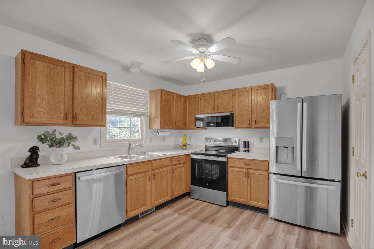 723 West 6th Street Lititz, PA 17543 - Photo 11 of 27 a kitchen with a sink cabinets stainless steel appliances and a window