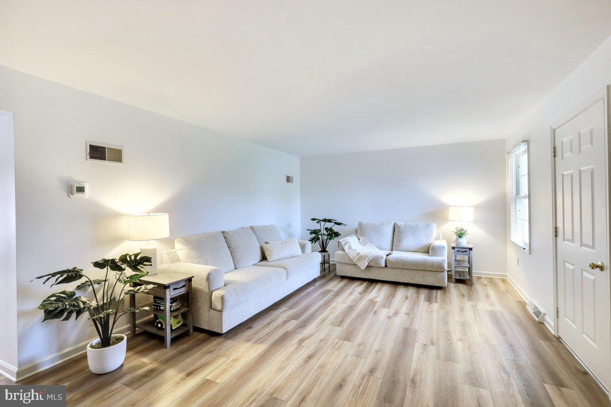 723 West 6th Street Lititz, PA 17543 - Photo 6 of 27 a living room with furniture and wooden floor