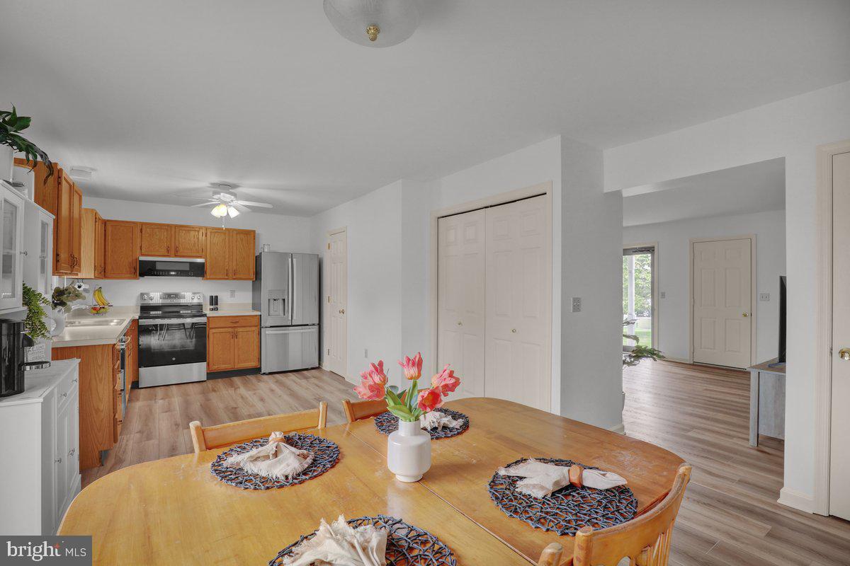 723 West 6th Street Lititz, PA 17543 - Photo 10 of 27 a kitchen with stainless steel appliances kitchen island granite countertop a dining table and chairs