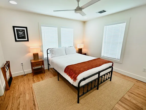 a bedroom with a bed and a couch