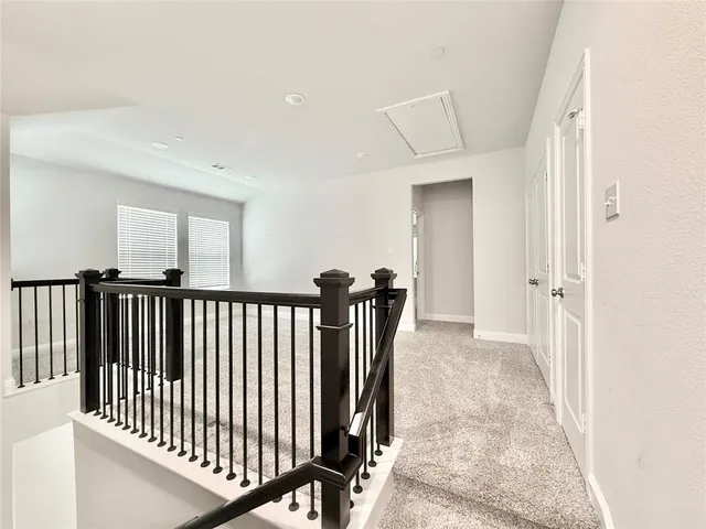 a view of a hallway with a porch