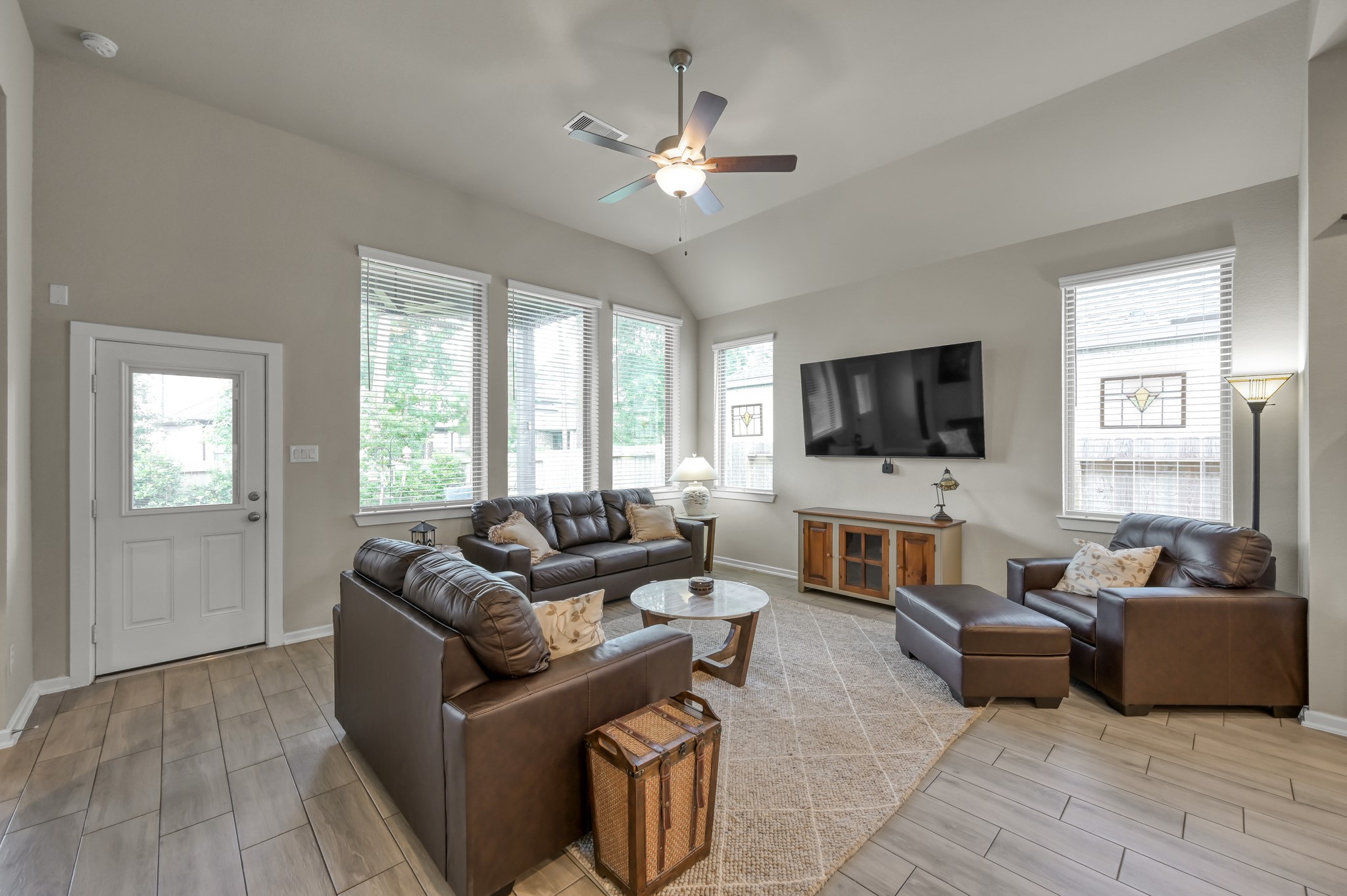 111 Yellow Perch Way Conroe, TX 77318 - Photo 11 of 35 Bright and inviting living area filled with natural light and overlooking the beautifully landscaped backyard.