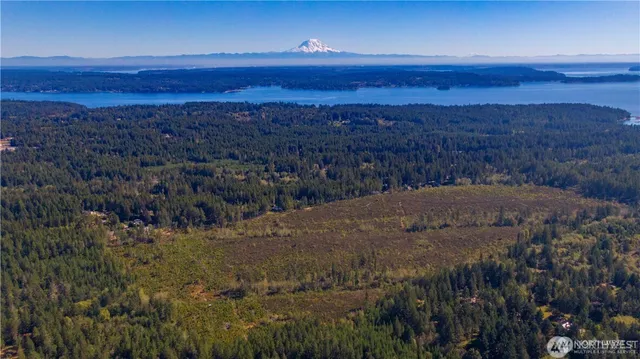 a view of a balcony with a yard
