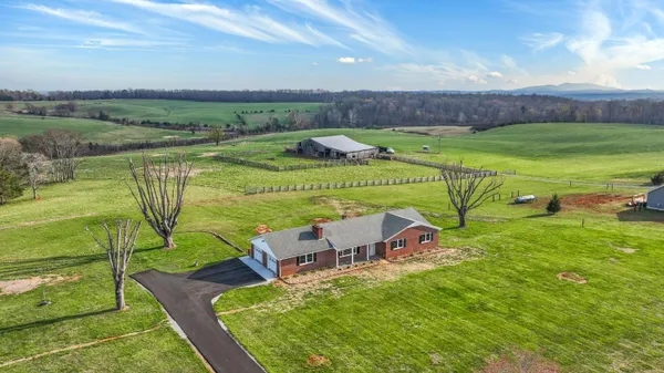a view of a table and chairs in the garden