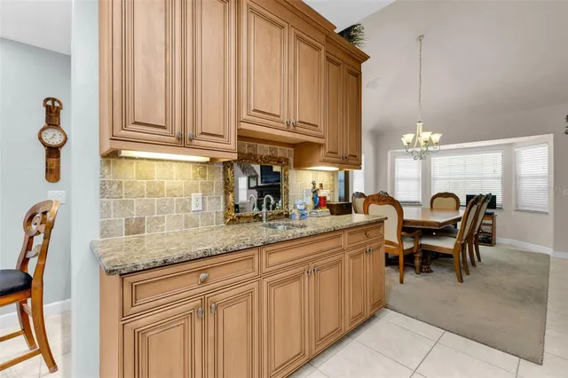 a spacious bathroom with a double vanity sink a mirror a bathtub and a shower