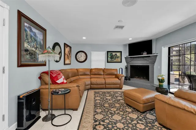 a bathroom with a granite countertop sink a toilet and a shower curtain