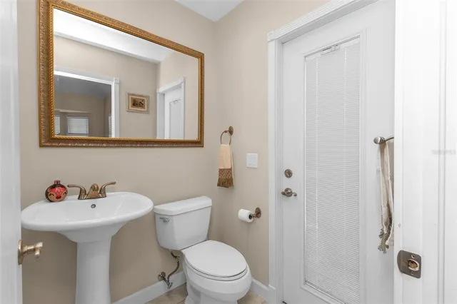 a view of a house with swimming pool and sitting area