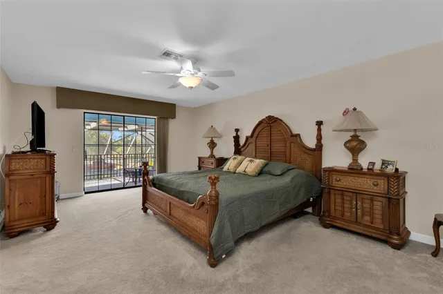 a view of a swimming pool with a patio and a yard