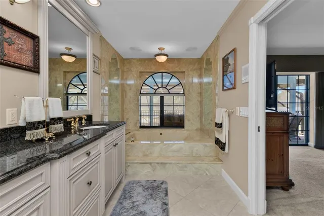 a aerial view of a house with a yard and garden