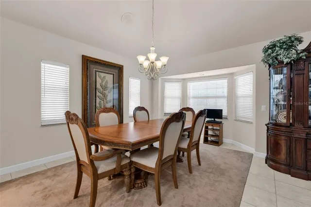 a spacious bathroom with a double vanity sink a mirror and a shower