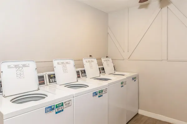 a kitchen with stove and cabinets