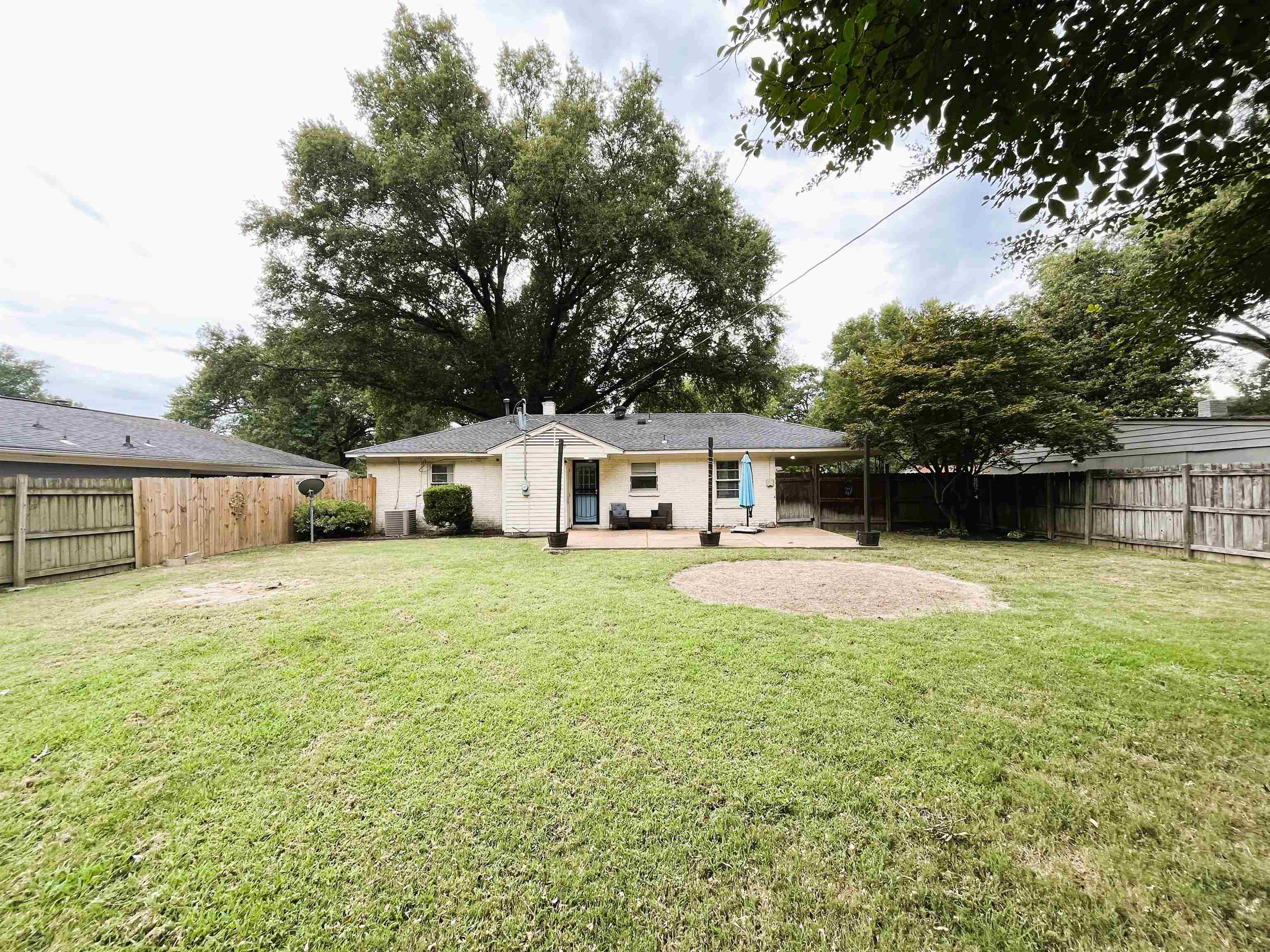 1570 Dearing Road Memphis, TN 38117 - Photo 15 of 16 Back of property with a fenced backyard and a patio area