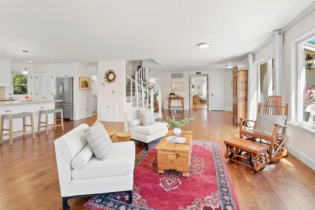 a building outdoor space with patio furniture and potted plants