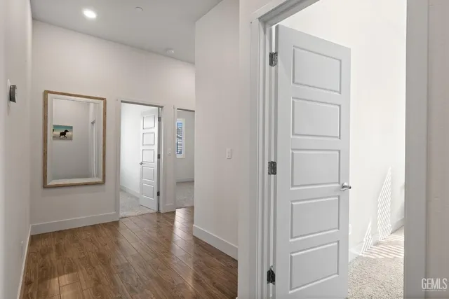 wooden floor with white walls