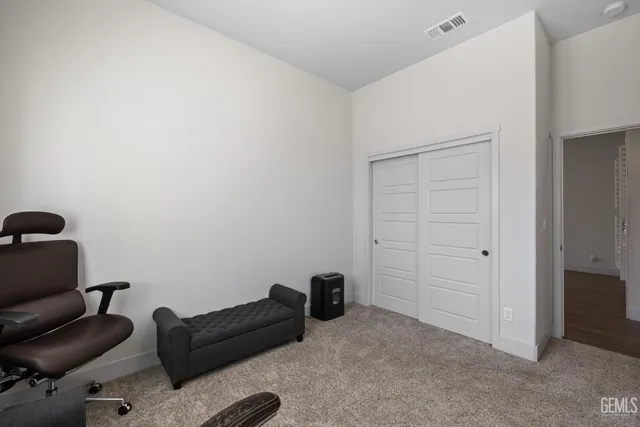 a livingroom with furniture and a gate