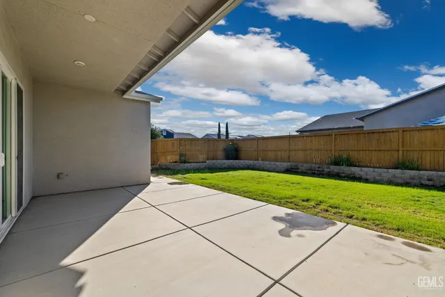a view of backyard with green space