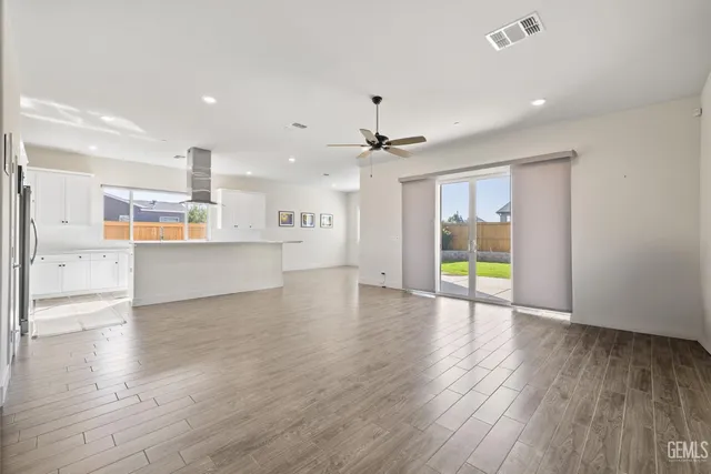 a view of a kitchen with a sink and a stove top oven