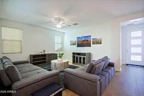a living room with furniture and a large window