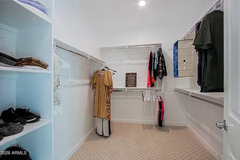 a white bath tub sitting next to a white sink and a shower