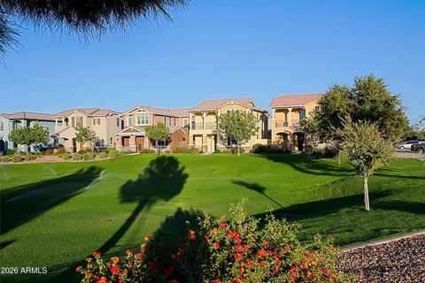 a view of a pathway with a garden