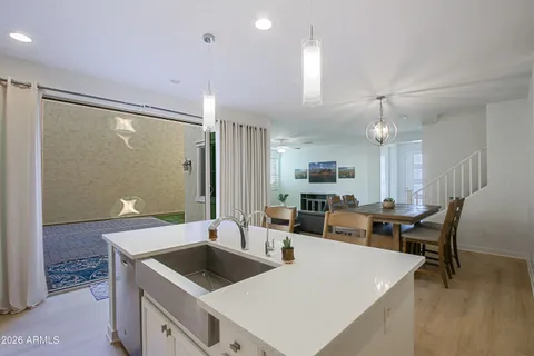 a kitchen with a sink cabinets and stainless steel appliances