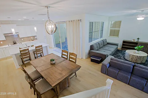 a view of a dining room with furniture window and wooden floor
