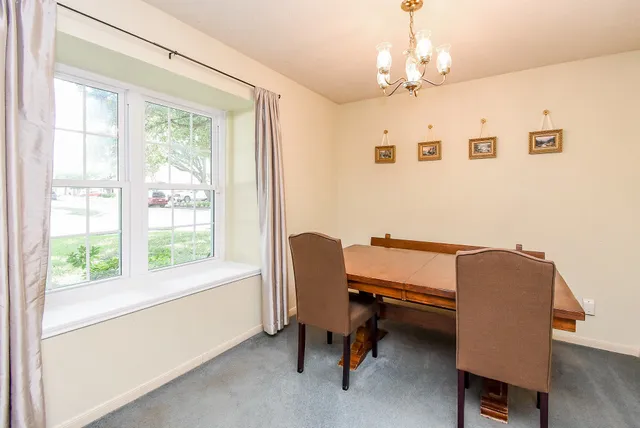 a bathroom with a sink mirror and toilet