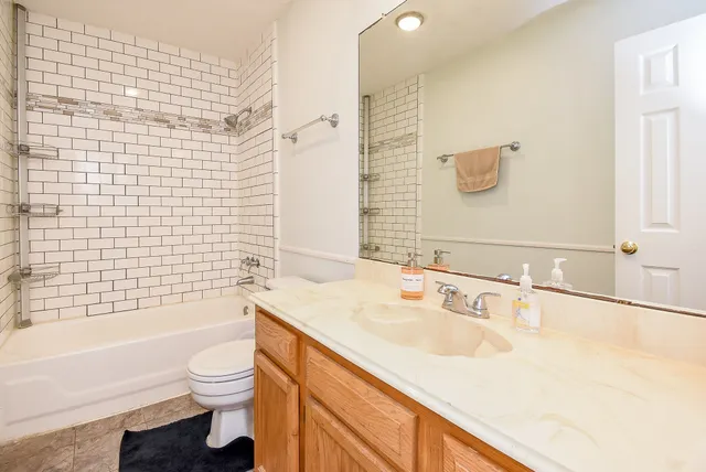 a bathroom with a bathtub and shower
