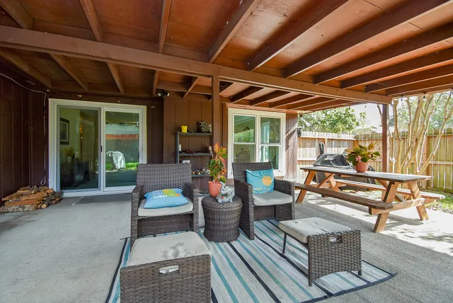 a outdoor space with patio the couches and a dining table with the garden view