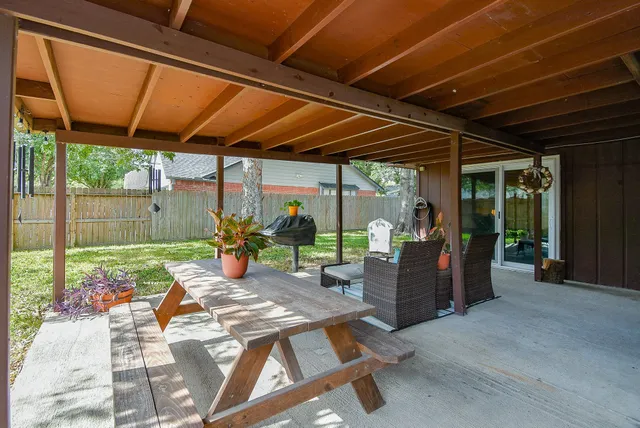 a view of a patio with a table chairs and a patio