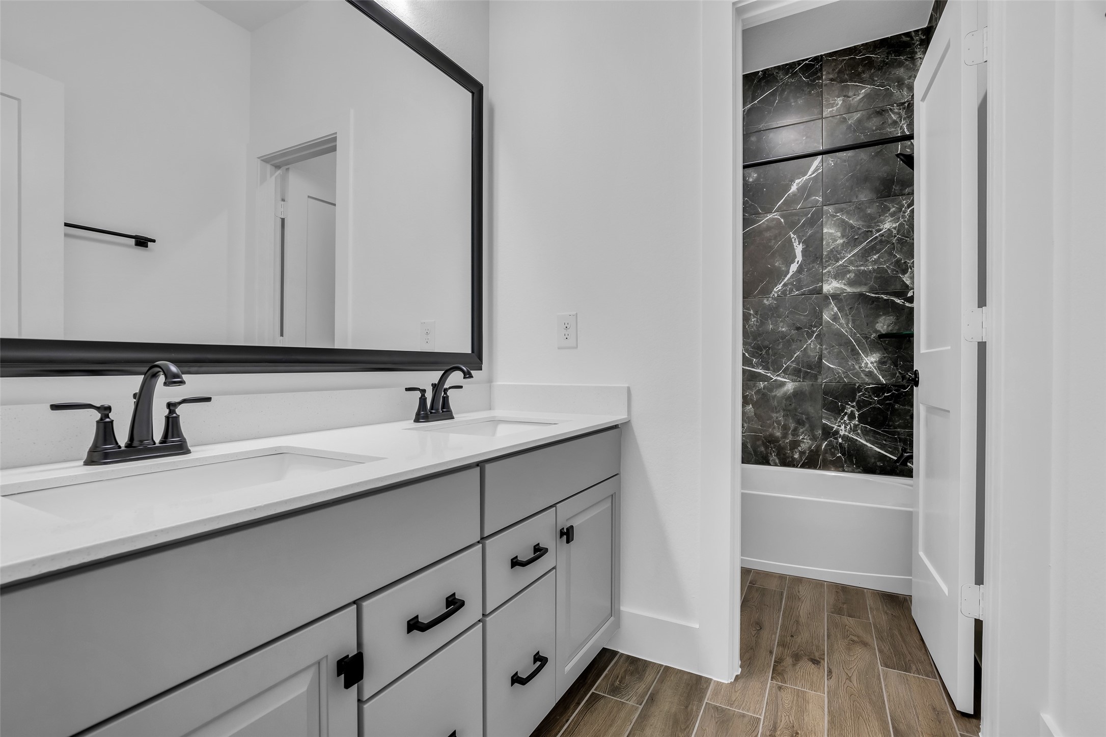 12853 Meadow Wind Way Conroe, TX 77302 - Photo 36 of 47 Hall Bath with double vanity, storage and separated Tub/shower combo and Toilet