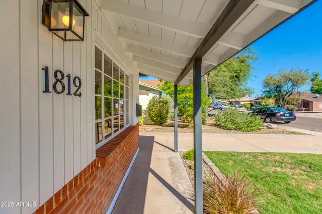 a view of a porch with wooden floor