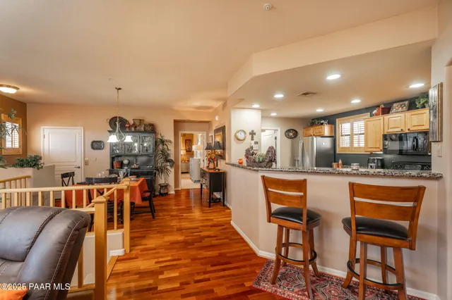 a large kitchen with a table and chairs