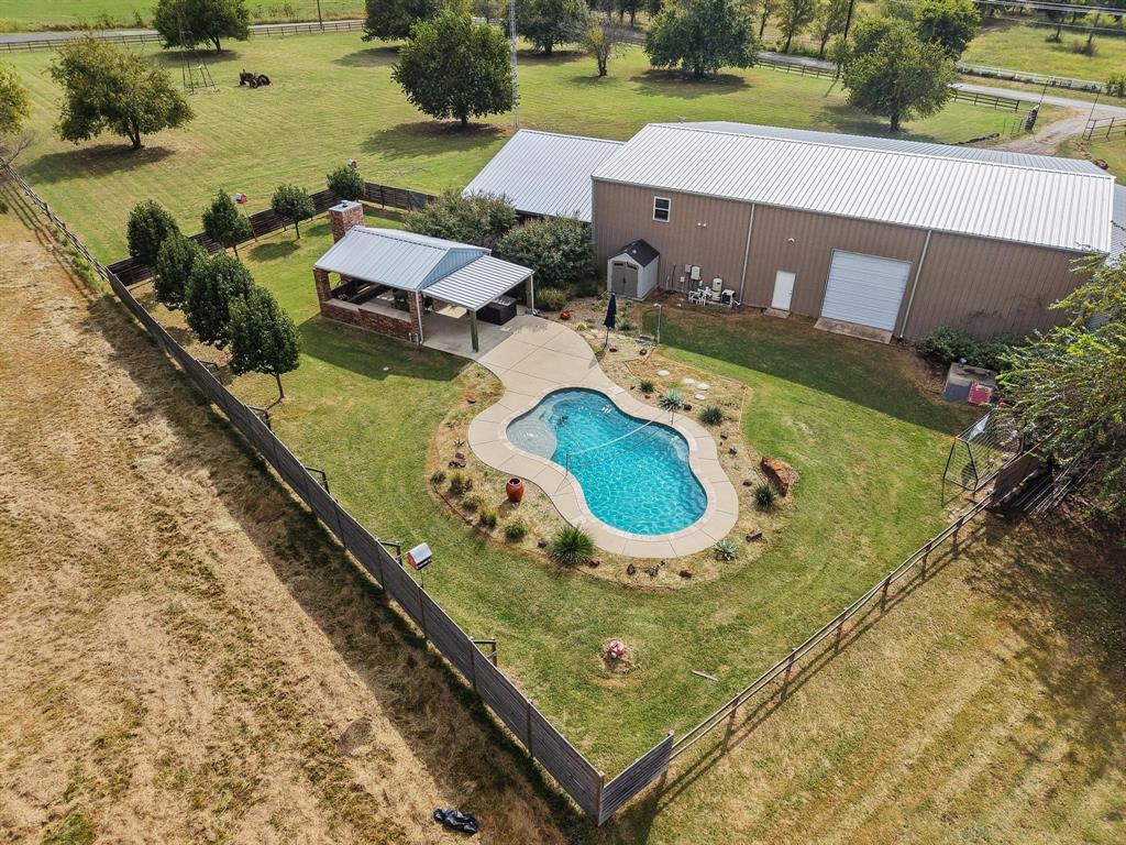 an aerial view of a house with outdoor space