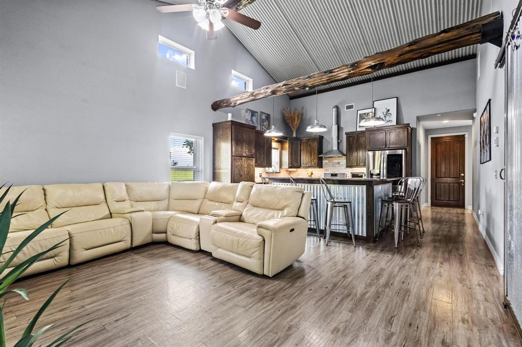 595 Pleasant Home Road Sherman, TX 75092 - Photo 13 of 40 a living room with furniture and wooden floor
