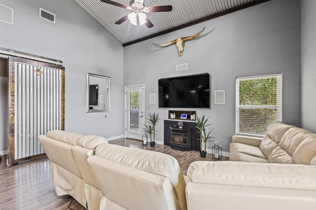 595 Pleasant Home Road Sherman, TX 75092 - Photo 14 of 40 a living room with furniture and a flat screen tv