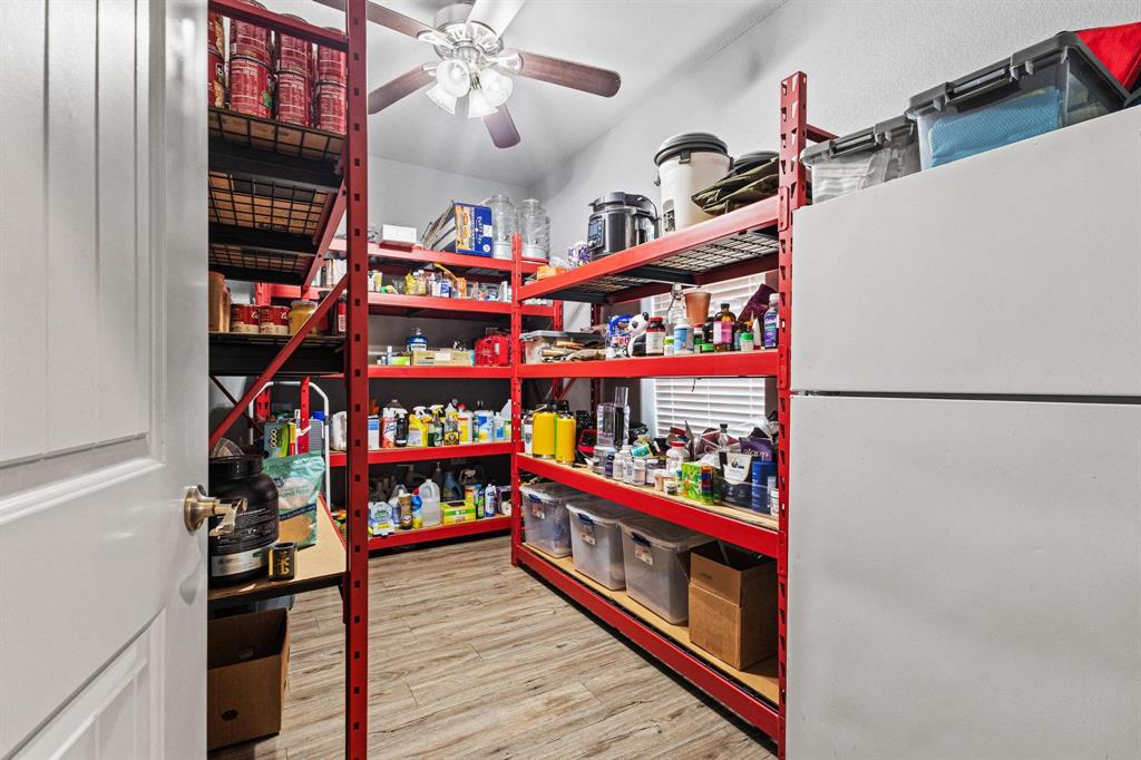 595 Pleasant Home Road Sherman, TX 75092 - Photo 21 of 40 a view of a living room with furniture and wooden floor