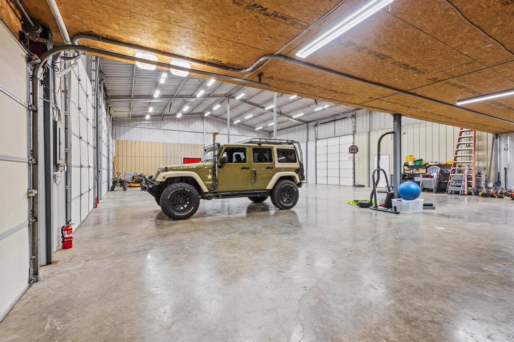 595 Pleasant Home Road Sherman, TX 75092 - Photo 24 of 40 a view of parking garage with cars