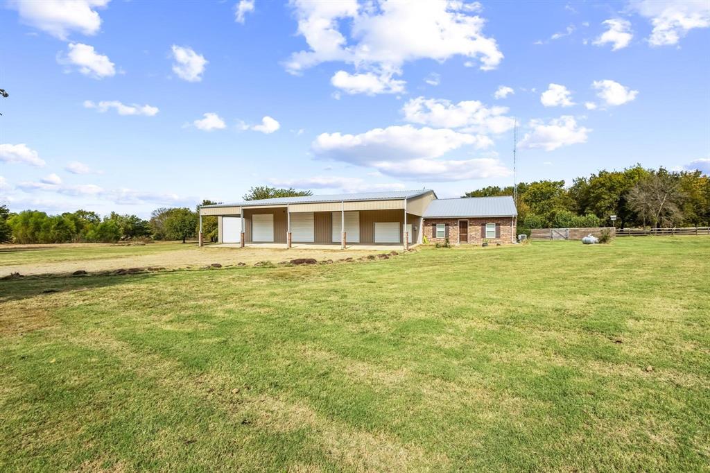 595 Pleasant Home Road Sherman, TX 75092 - Photo 3 of 40 a house view with swimming pool and trees in the background