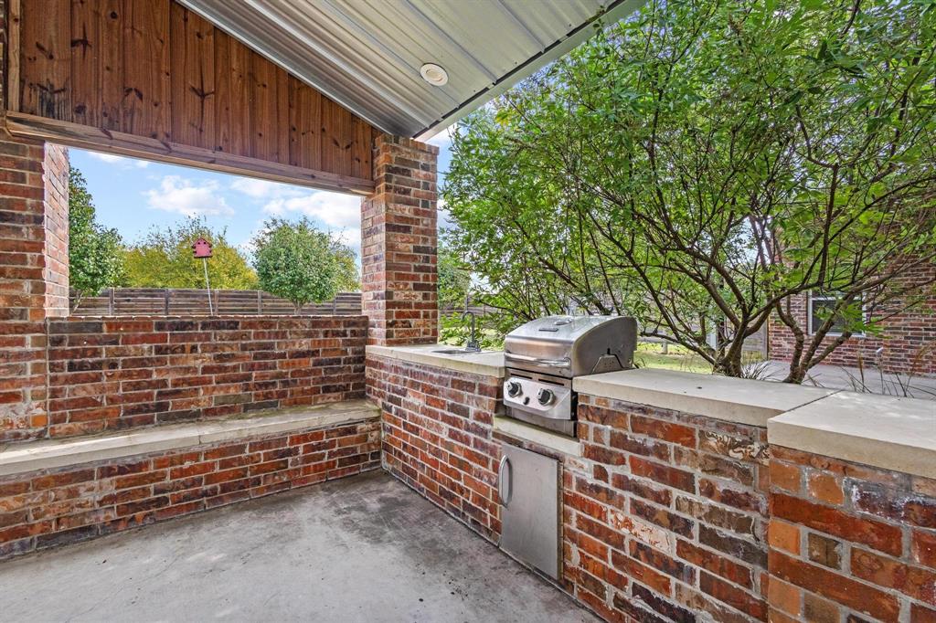 595 Pleasant Home Road Sherman, TX 75092 - Photo 32 of 40 a outdoor space with barbeque oven