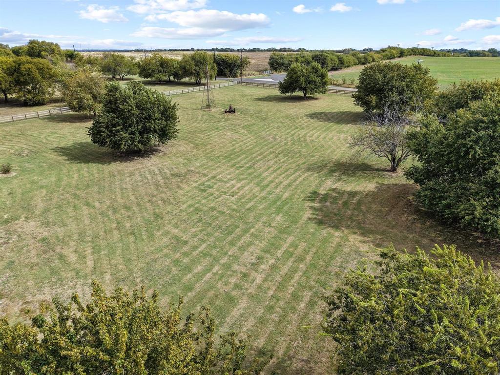 595 Pleasant Home Road Sherman, TX 75092 - Photo 38 of 40 a view of a yard with an outdoor seating