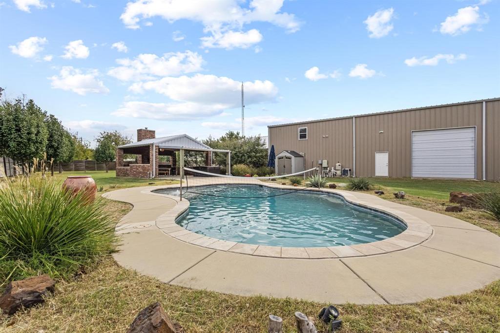 595 Pleasant Home Road Sherman, TX 75092 - Photo 6 of 40 a view of a swimming pool with an outdoor seating